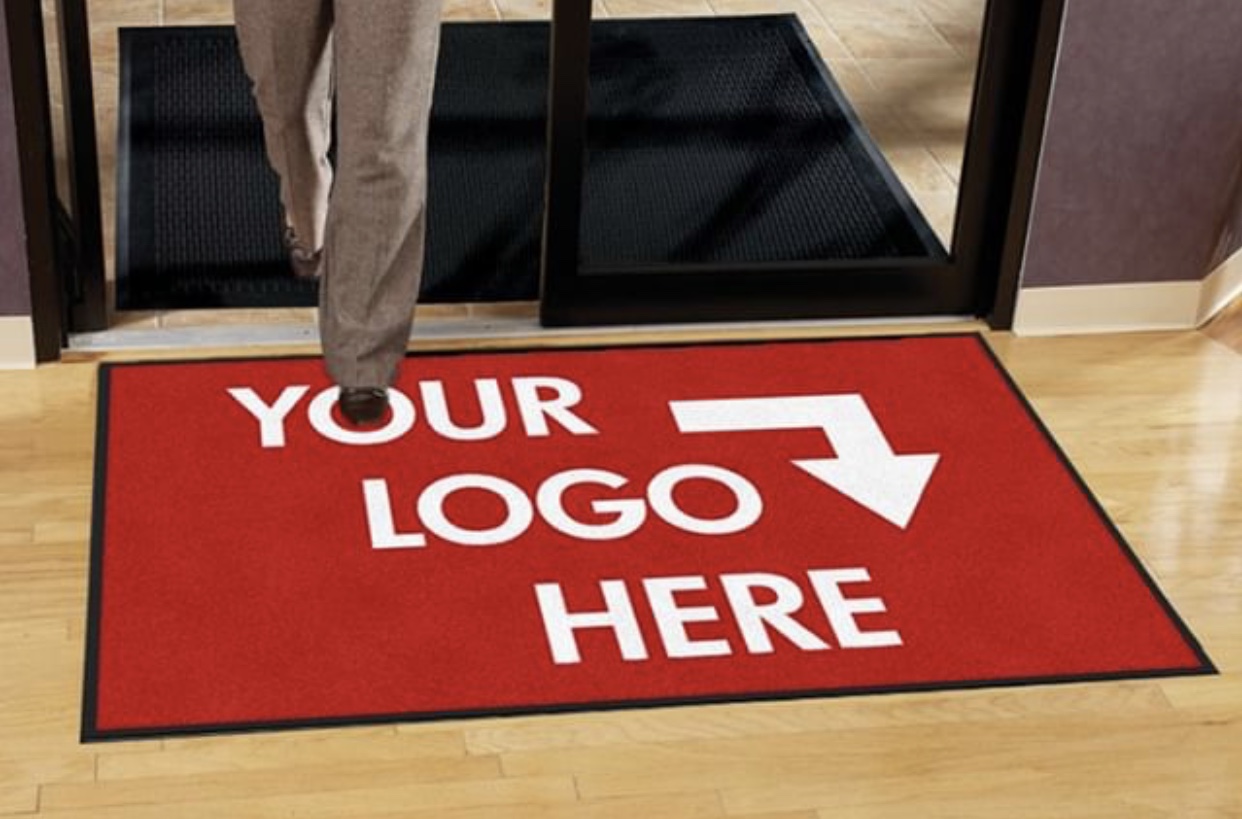 A mat with words that say "Your Logo Here"