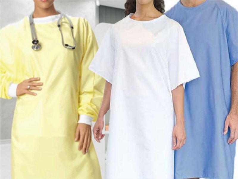 Three people wearing medical gowns