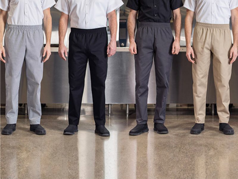 Four people wearing chef pants