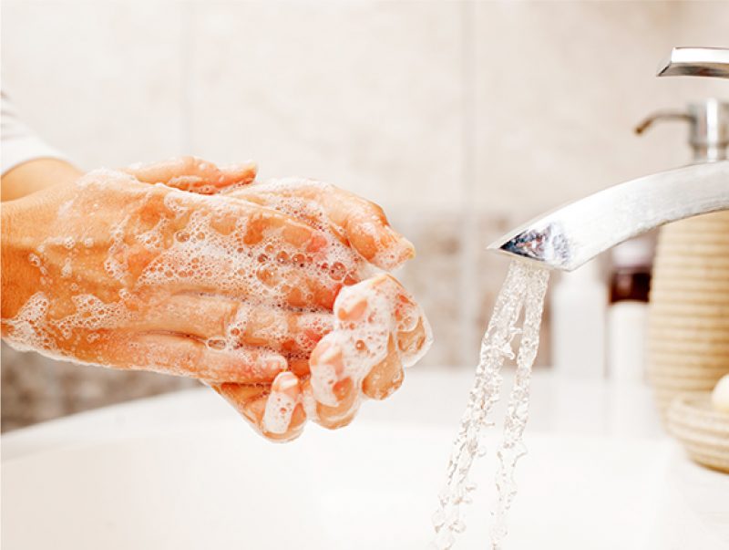 Up close washing hands with soap
