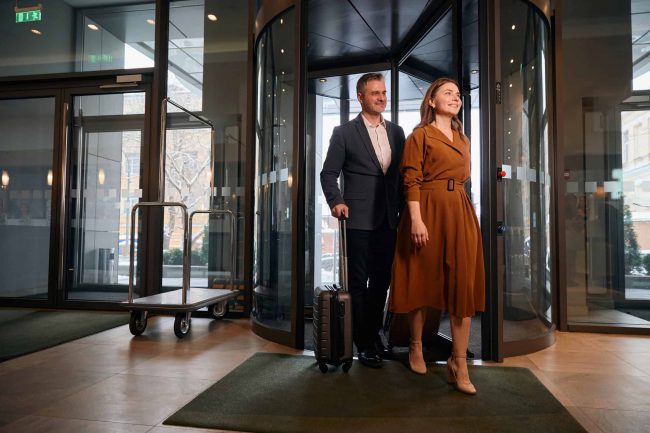 adult-caucasian-couple-with-suitcases-entering-to-2025-03-08-05-41-37-utc (1)