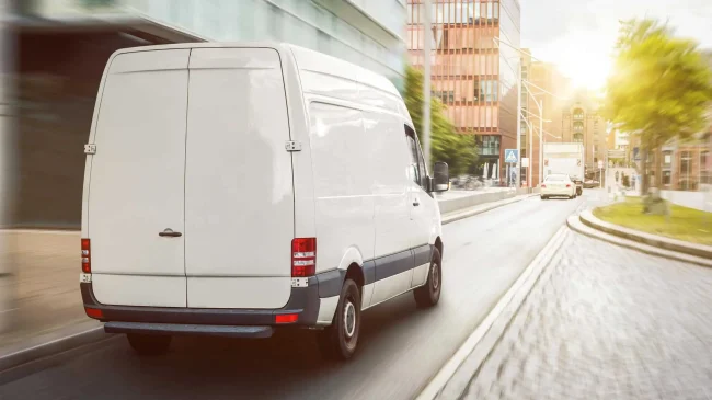 commercial-van-delivering-goods-in-a-cityscape-2026-03-16-23-02-24-utc