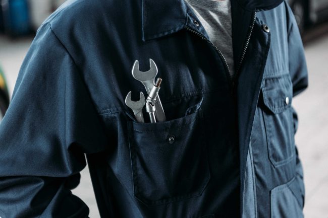 cropped-view-of-workman-in-overalls-with-wrenches-2024-11-19-06-23-20-utc_1
