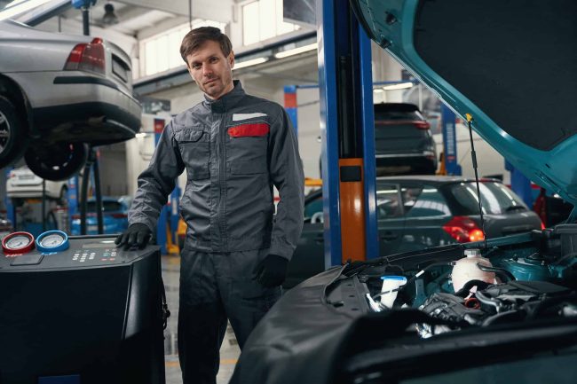 portrait-of-mechanic-standing-in-workshop-and-work-2025-03-08-16-43-50-utc (1)