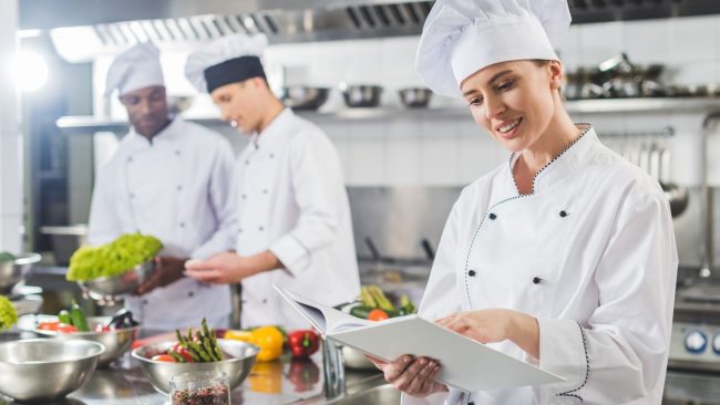 rental uniforms - chefs working in a kitchen